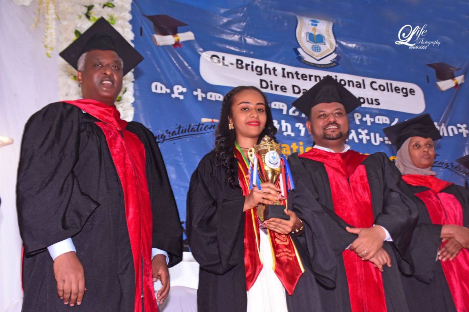 Ol-Bright graduates celebrating with an award